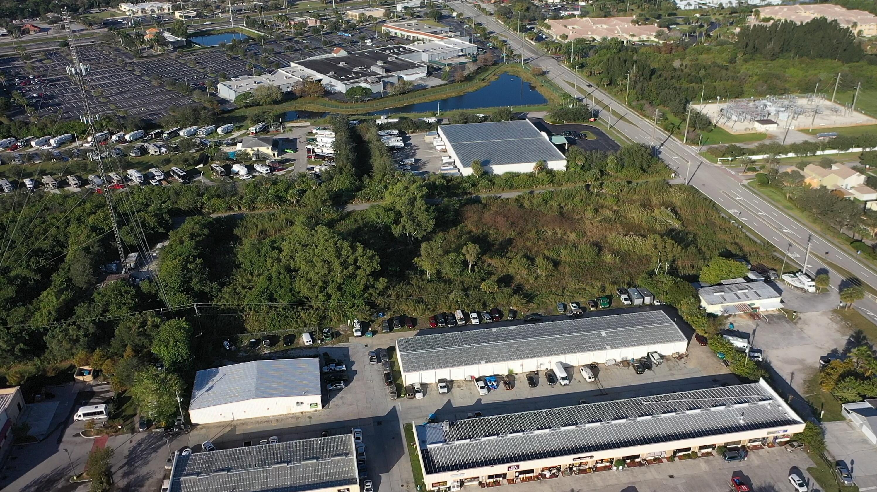 3775 Southeast Jennings Road Port St. Lucie, FL 34952 - Photo 3 of 14 an aerial view of a house with a garden