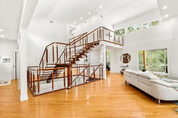 a living room with fireplace furniture and a wooden floor