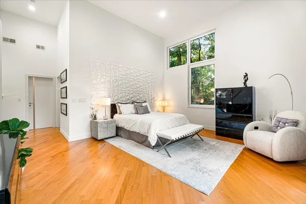a bedroom with a bed and a fireplace
