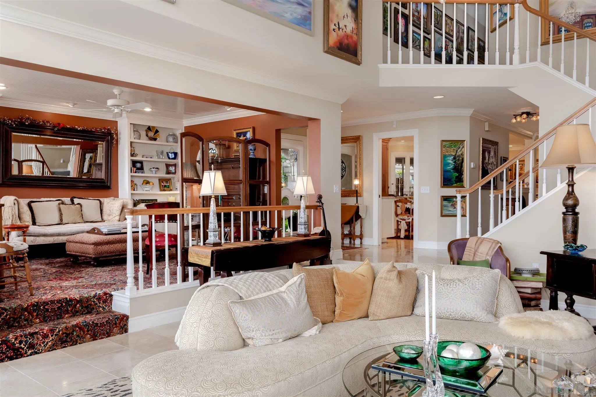 12 Buccaneer Way Coronado, CA 92118 - Photo 11 of 34 a living room with furniture and a book shelf