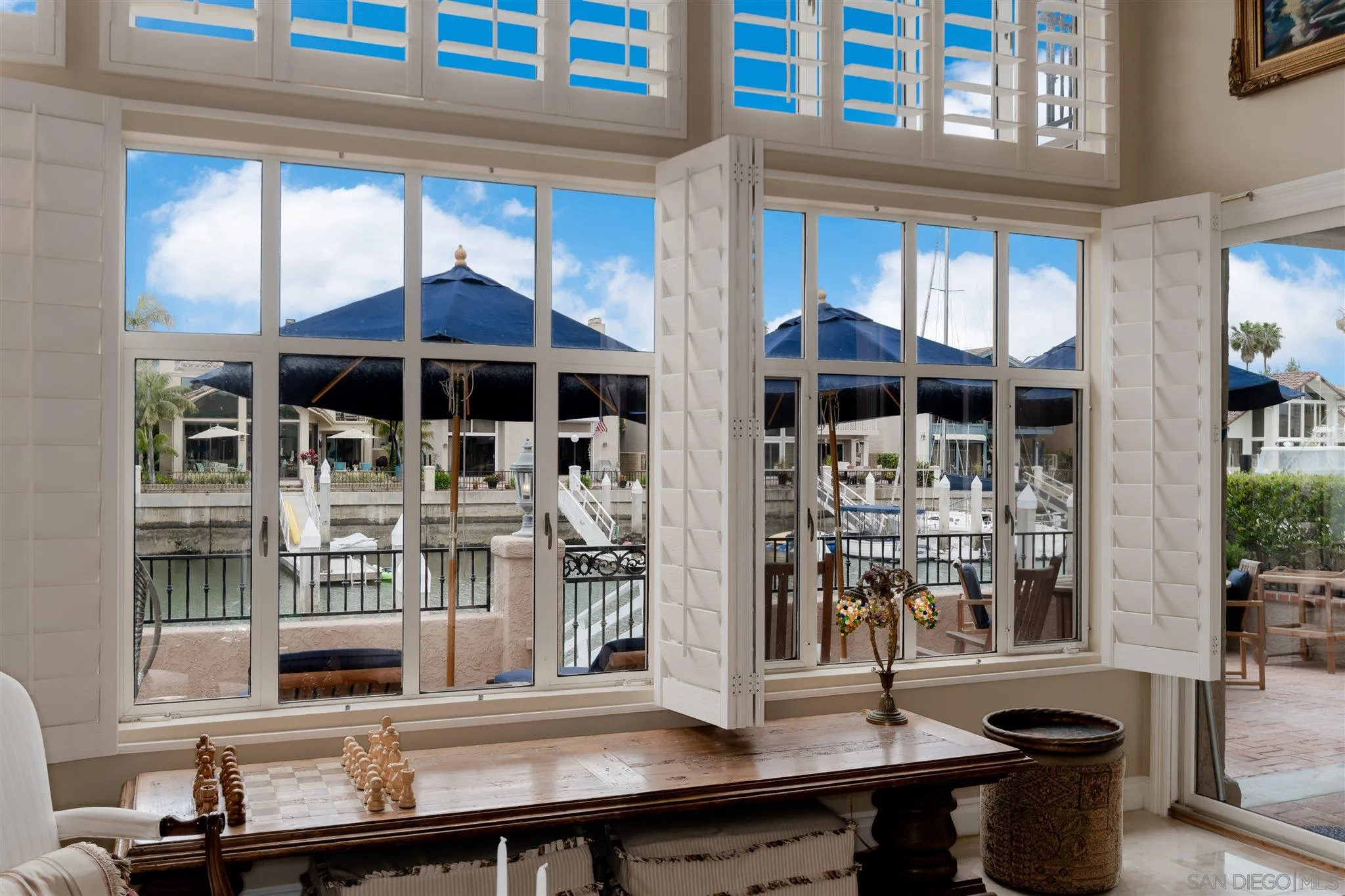 12 Buccaneer Way Coronado, CA 92118 - Photo 12 of 34 a table and chairs in front of a window