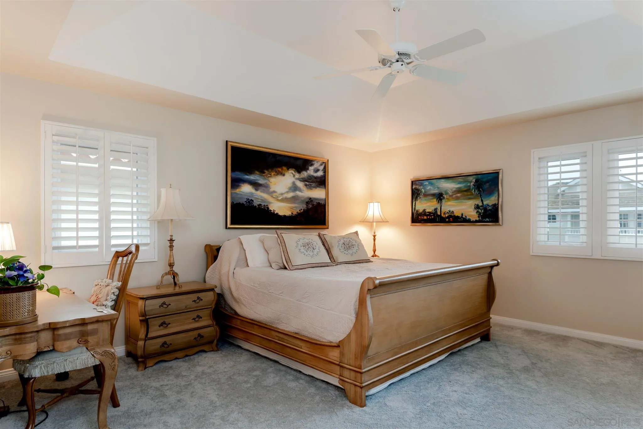 12 Buccaneer Way Coronado, CA 92118 - Photo 23 of 34 a bedroom with a bed a couch and a flat screen tv