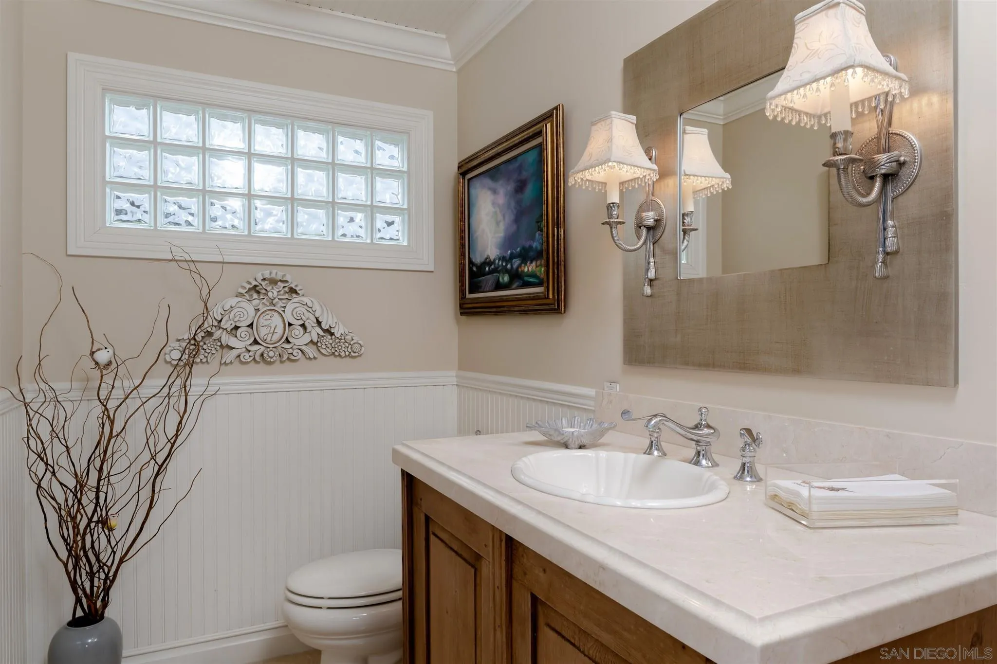 12 Buccaneer Way Coronado, CA 92118 - Photo 24 of 34 a bathroom with a sink toilet and a mirror