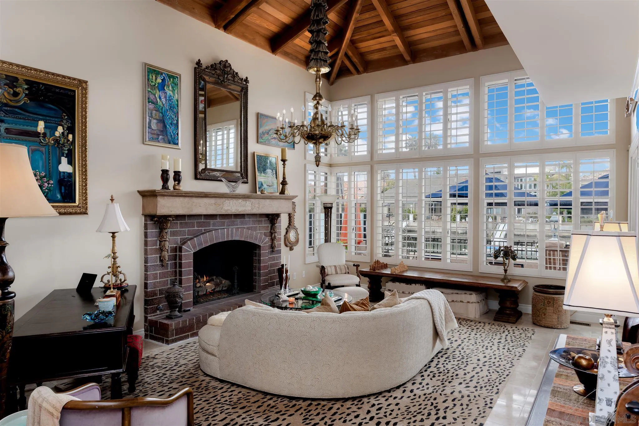 12 Buccaneer Way Coronado, CA 92118 - Photo 3 of 34 a living room with furniture a fireplace and a table