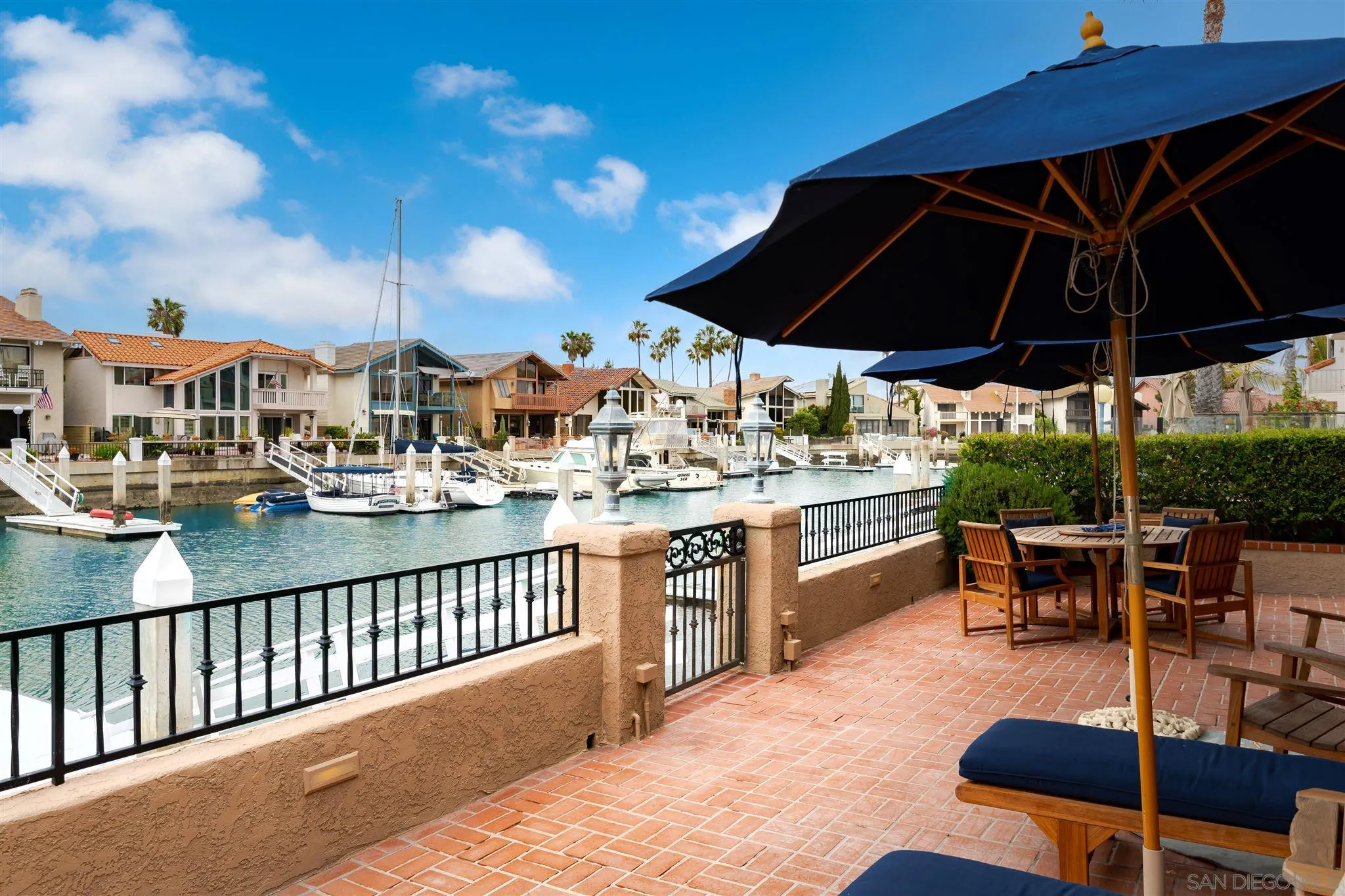 12 Buccaneer Way Coronado, CA 92118 - Photo 31 of 34 a outdoor view of a patio with swimming pool table and chairs