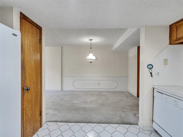 a view of a room with a fireplace and cabinet
