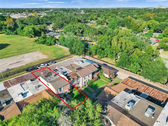 an aerial view of a house with a garden
