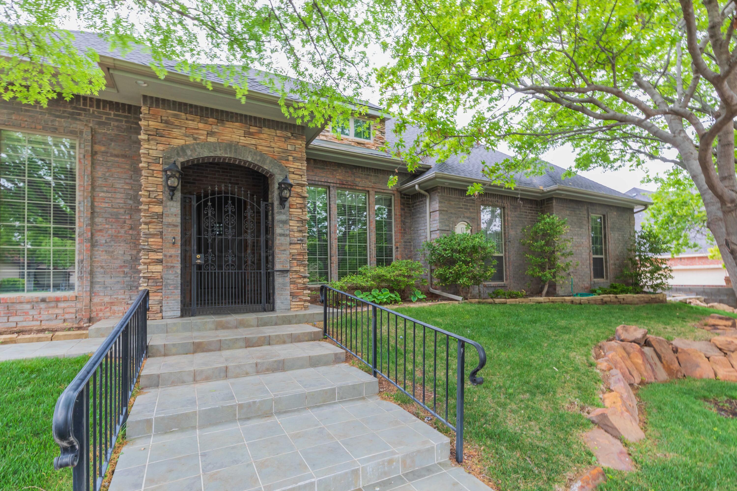 a view of house with yard and entertaining space