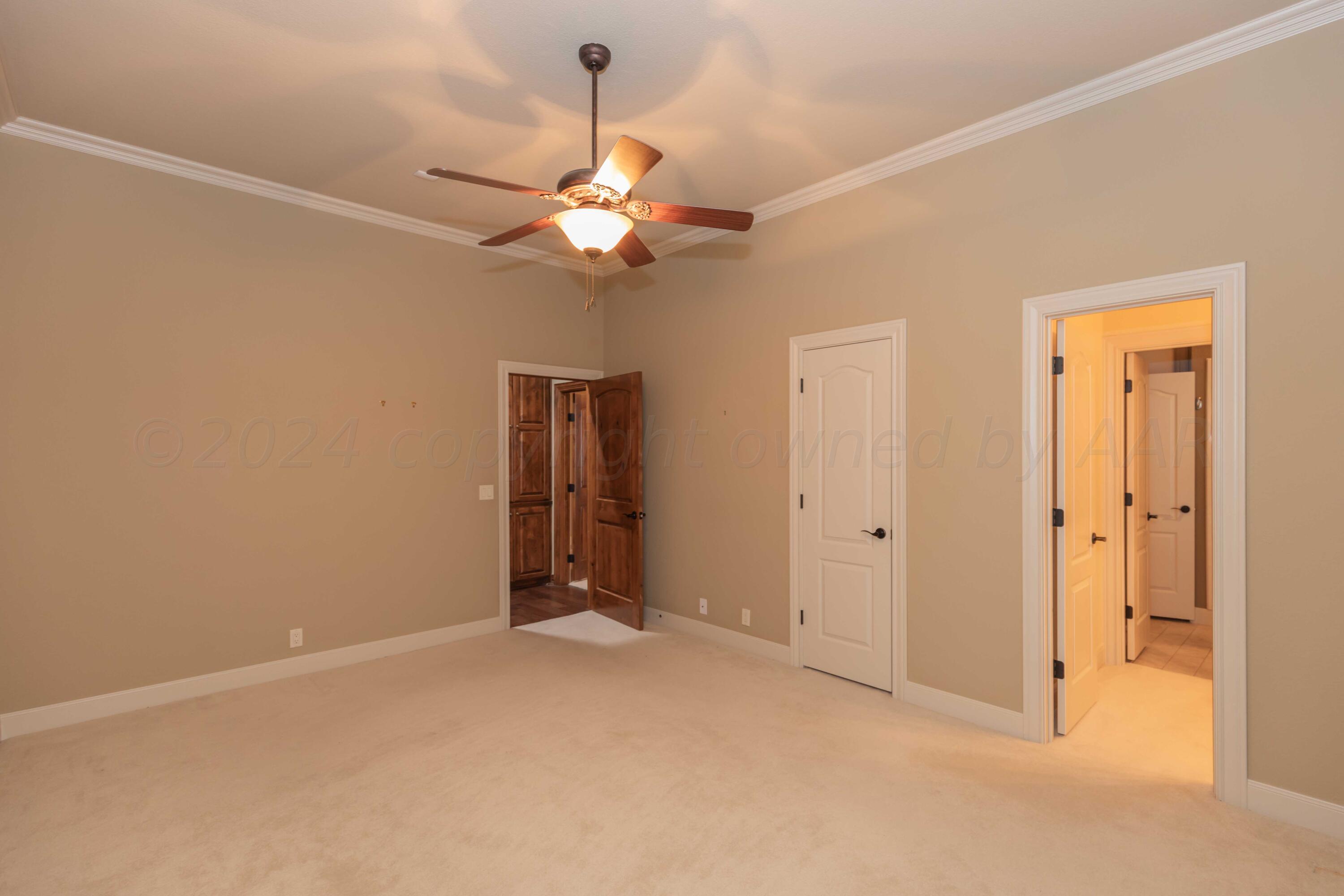 17 Cypress Point Amarillo, TX 79124 - Photo 30 of 72 an empty room with closet and a chandelier fan