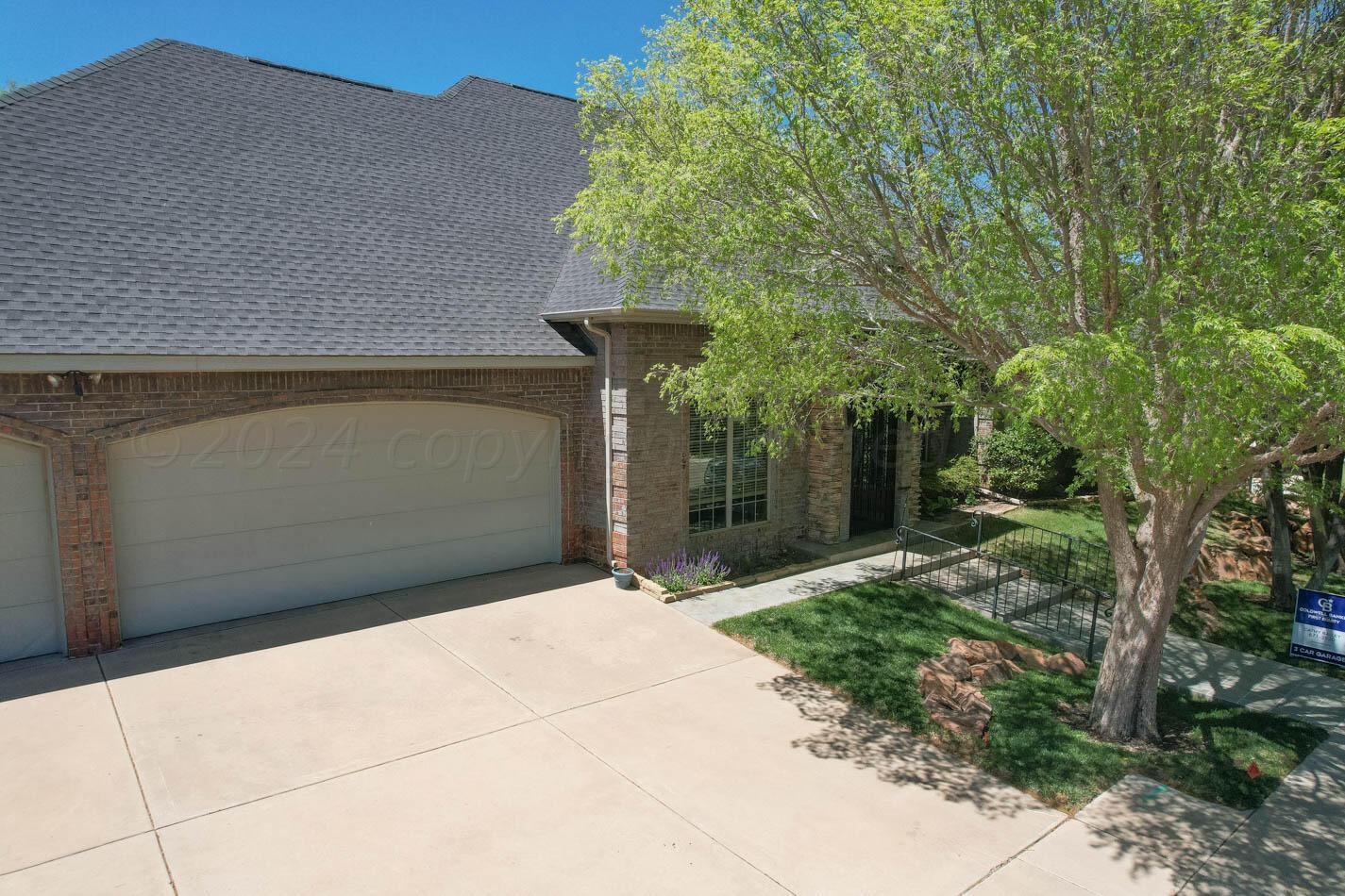 17 Cypress Point Amarillo, TX 79124 - Photo 47 of 72 a front view of a house with a yard and garage