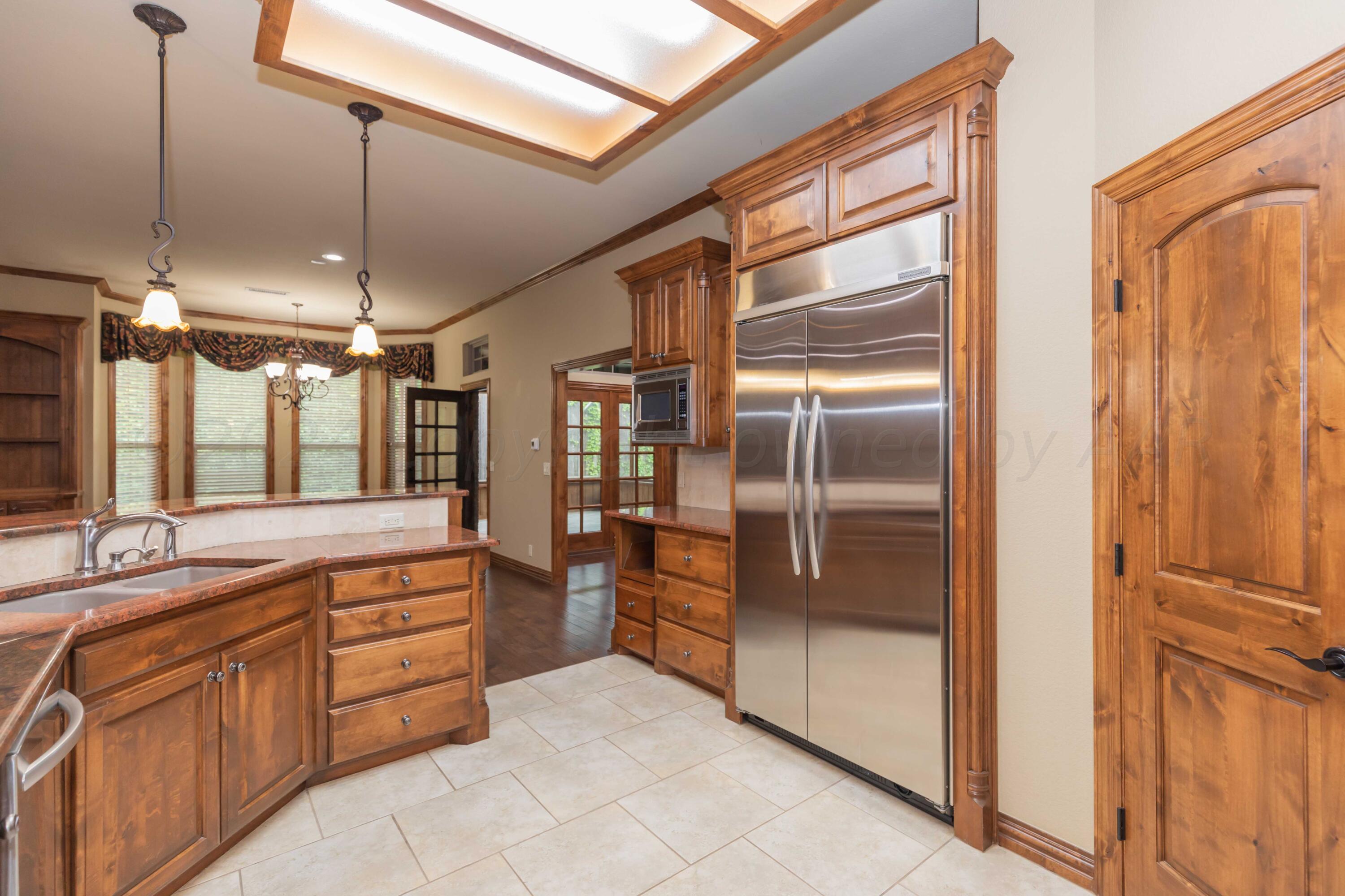 17 Cypress Point Amarillo, TX 79124 - Photo 59 of 72 a large kitchen with a refrigerator a sink and dishwasher