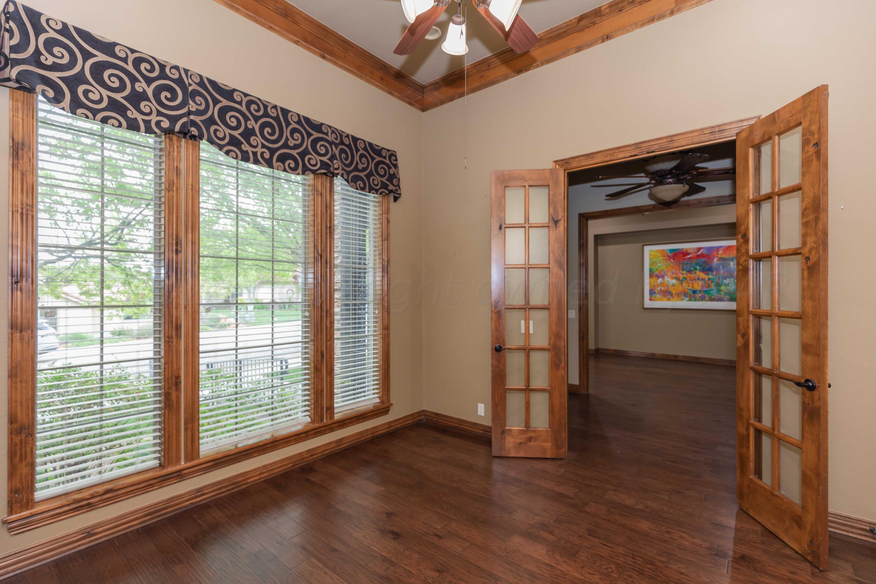 17 Cypress Point Amarillo, TX 79124 - Photo 8 of 72 a view of empty room with wooden floor and fan