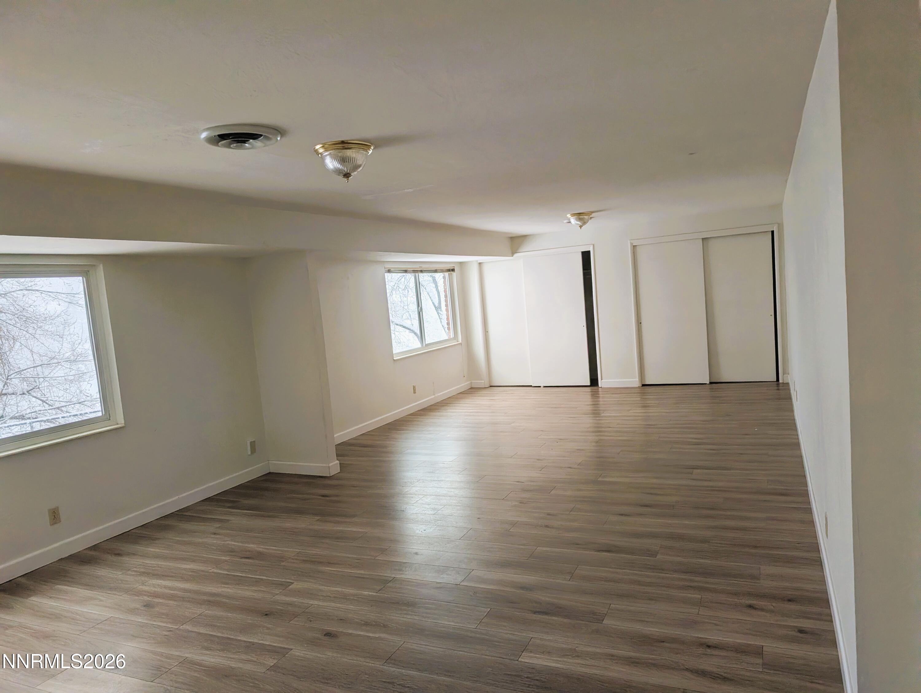 2390 Barnes Circle Reno, NV 89509 - Photo 13 of 13 a view of an empty room with wooden floor and a window