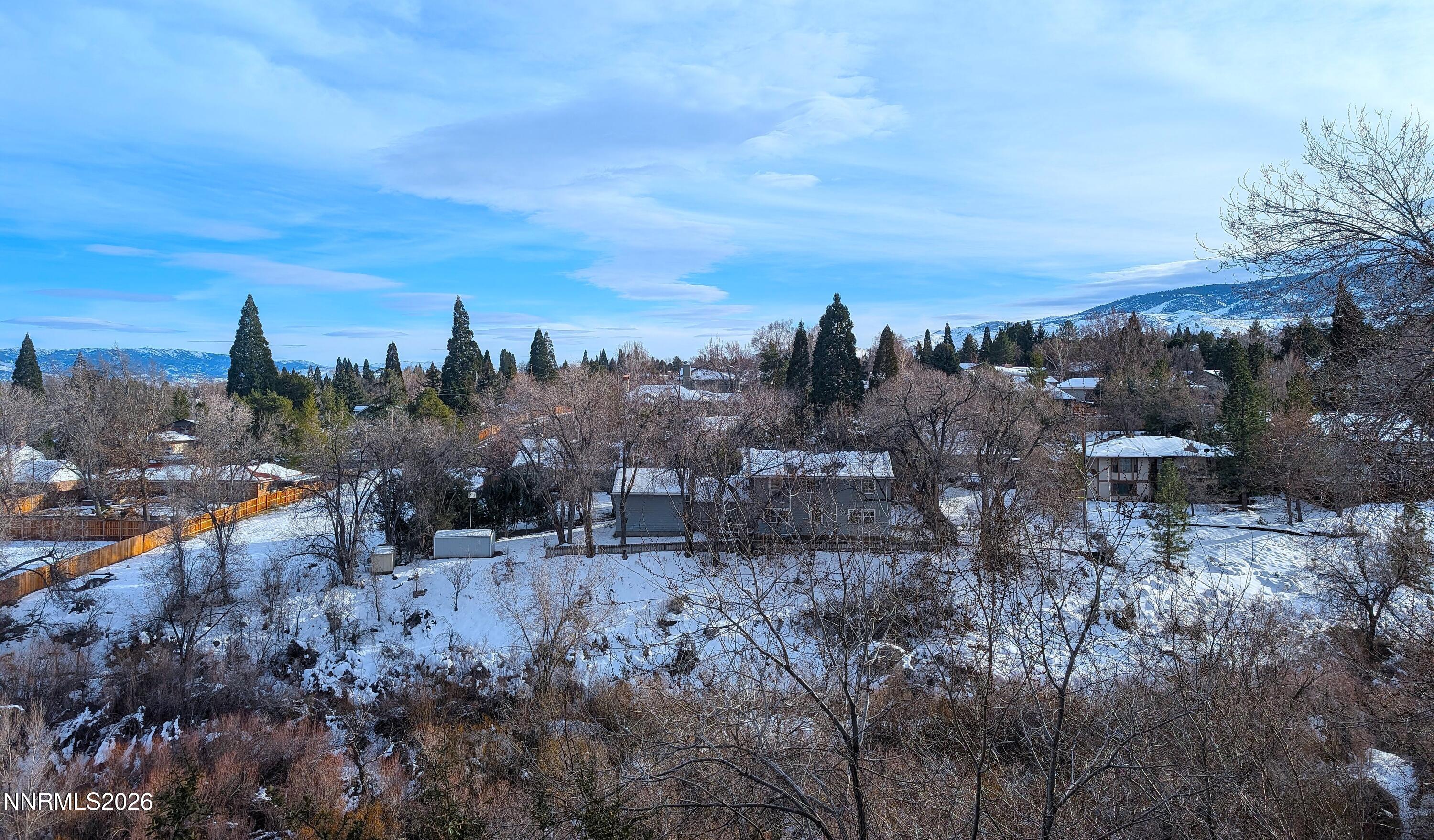 2390 Barnes Circle Reno, NV 89509 - Photo 7 of 13 a view of a outdoor space with green field and trees
