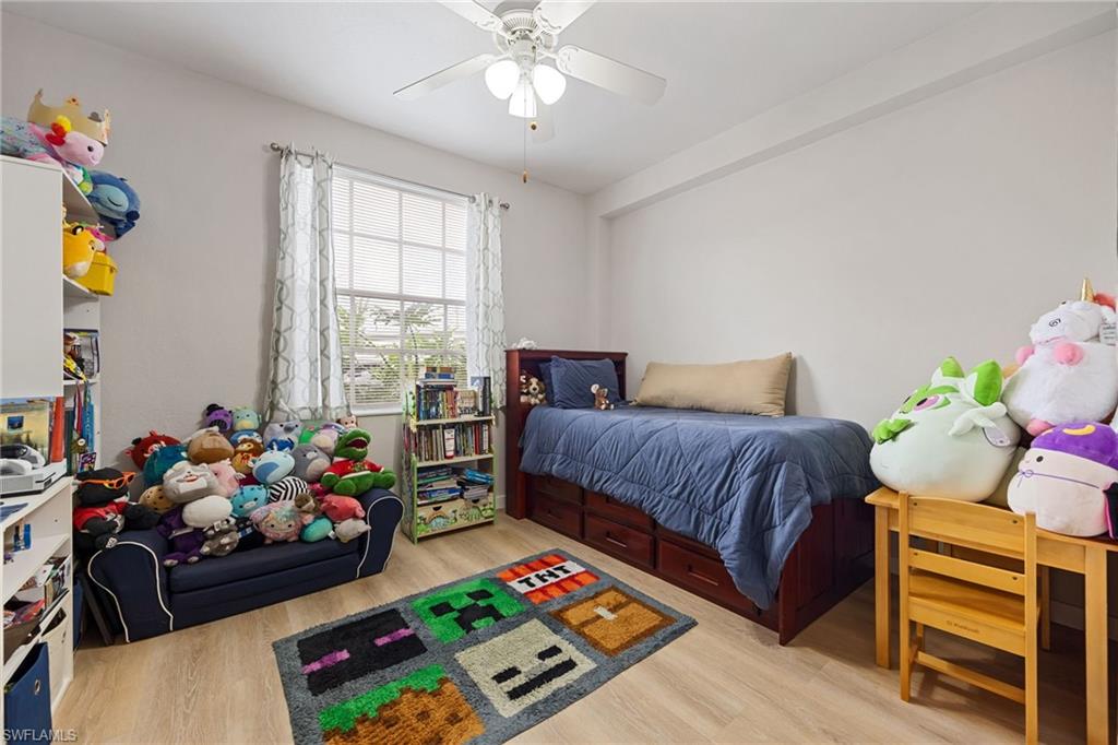 4710 St Croix Lane, Unit 216 Naples, FL 34109 - Photo 20 of 29 a bedroom with bed and a window