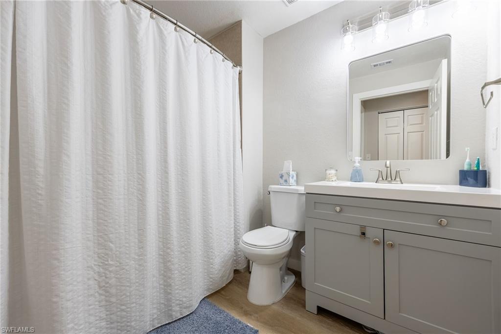 4710 St Croix Lane, Unit 216 Naples, FL 34109 - Photo 21 of 29 a bathroom with a sink toilet and shower