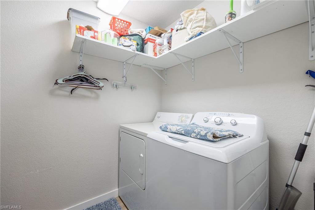 4710 St Croix Lane, Unit 216 Naples, FL 34109 - Photo 23 of 29 a utility room with dryer and washer