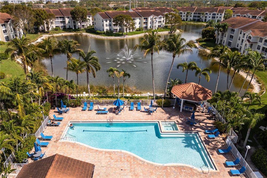 4710 St Croix Lane, Unit 216 Naples, FL 34109 - Photo 24 of 29 an aerial view of a house with a lake view