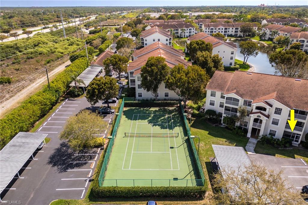 4710 St Croix Lane, Unit 216 Naples, FL 34109 - Photo 26 of 29 an aerial view of residential houses with outdoor space