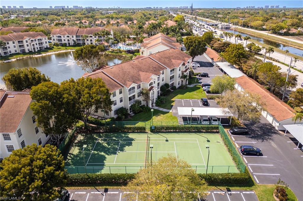 4710 St Croix Lane, Unit 216 Naples, FL 34109 - Photo 27 of 29 an aerial view of residential houses with outdoor space