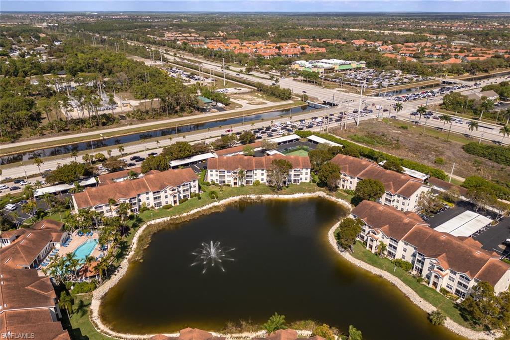 4710 St Croix Lane, Unit 216 Naples, FL 34109 - Photo 28 of 29 an aerial view of residential houses with outdoor space