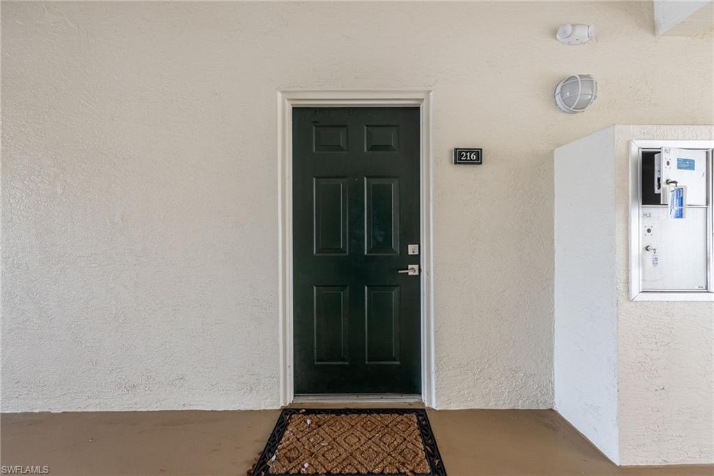 4710 St Croix Lane, Unit 216 Naples, FL 34109 - Photo 3 of 29 a view of a hallway