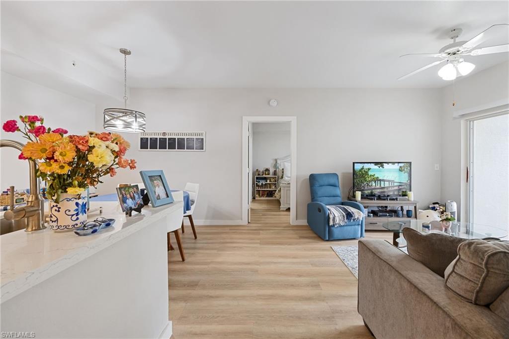 4710 St Croix Lane, Unit 216 Naples, FL 34109 - Photo 6 of 29 a living room with furniture and a flat screen tv