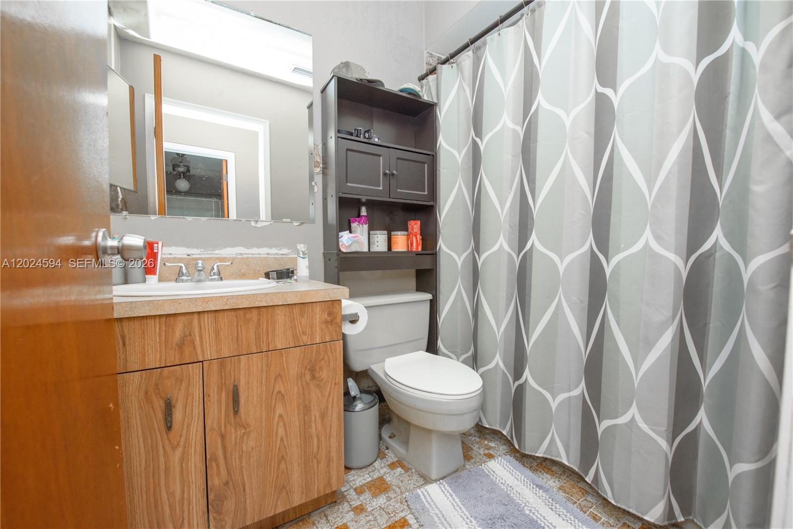 17355 Southwest 256th Street Homestead, FL 33031 - Photo 14 of 32 a bathroom with a sink toilet and shower