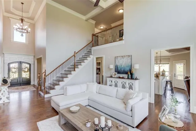 a kitchen with stainless steel appliances granite countertop a sink a stove and cabinets