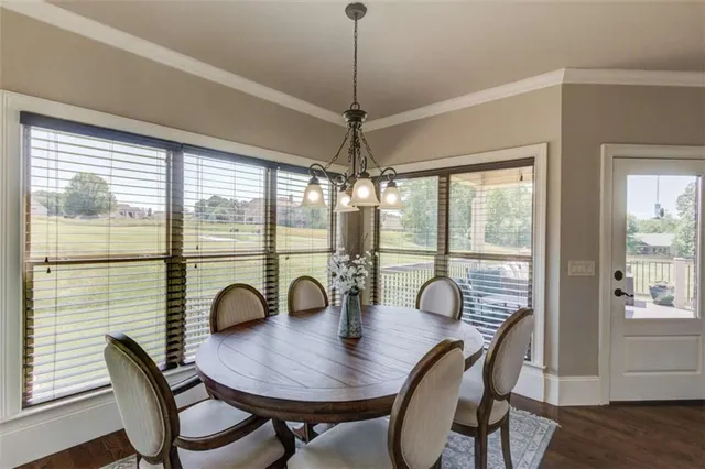 a bathroom with a granite countertop sink toilet a mirror and shower