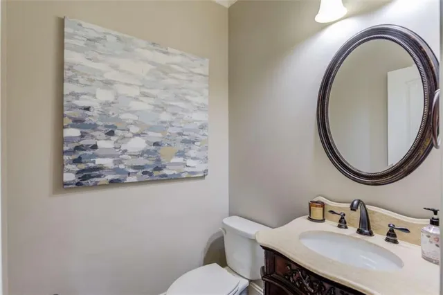 a bedroom with a bed and ceiling fan