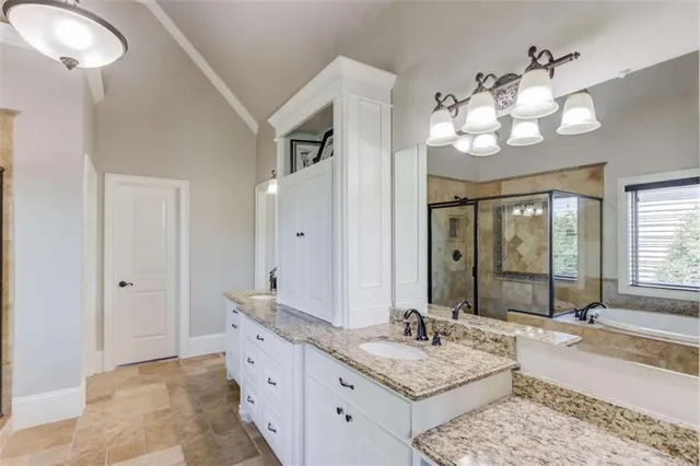 a living room with furniture a window and a flat screen tv