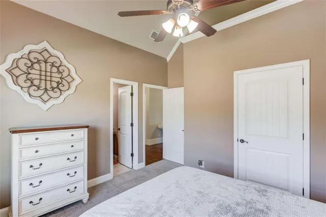 a living room with furniture and a ceiling fan