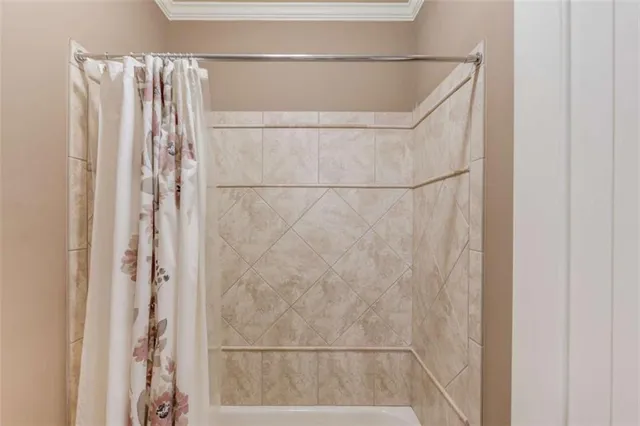 a view of swimming pool and lounge chairs in back yard