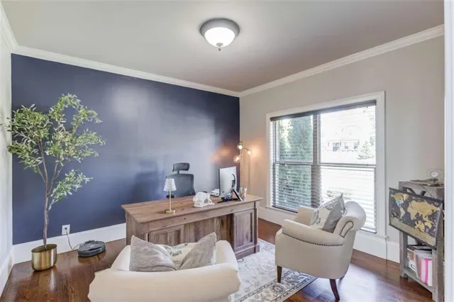 a living room with furniture a flat screen tv and a large window