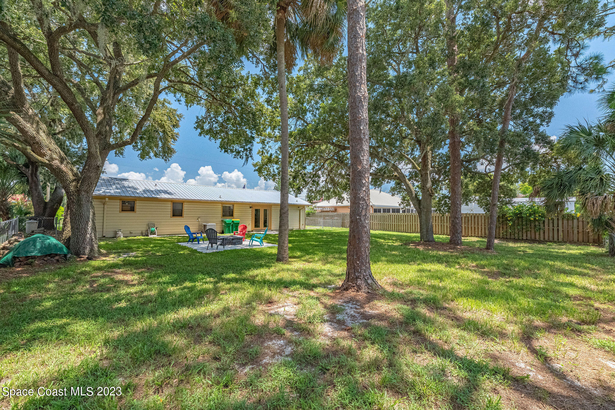 4505 Comfort Street Cocoa, FL 32927 - Photo 11 of 30 a view of a house with a yard and sitting area