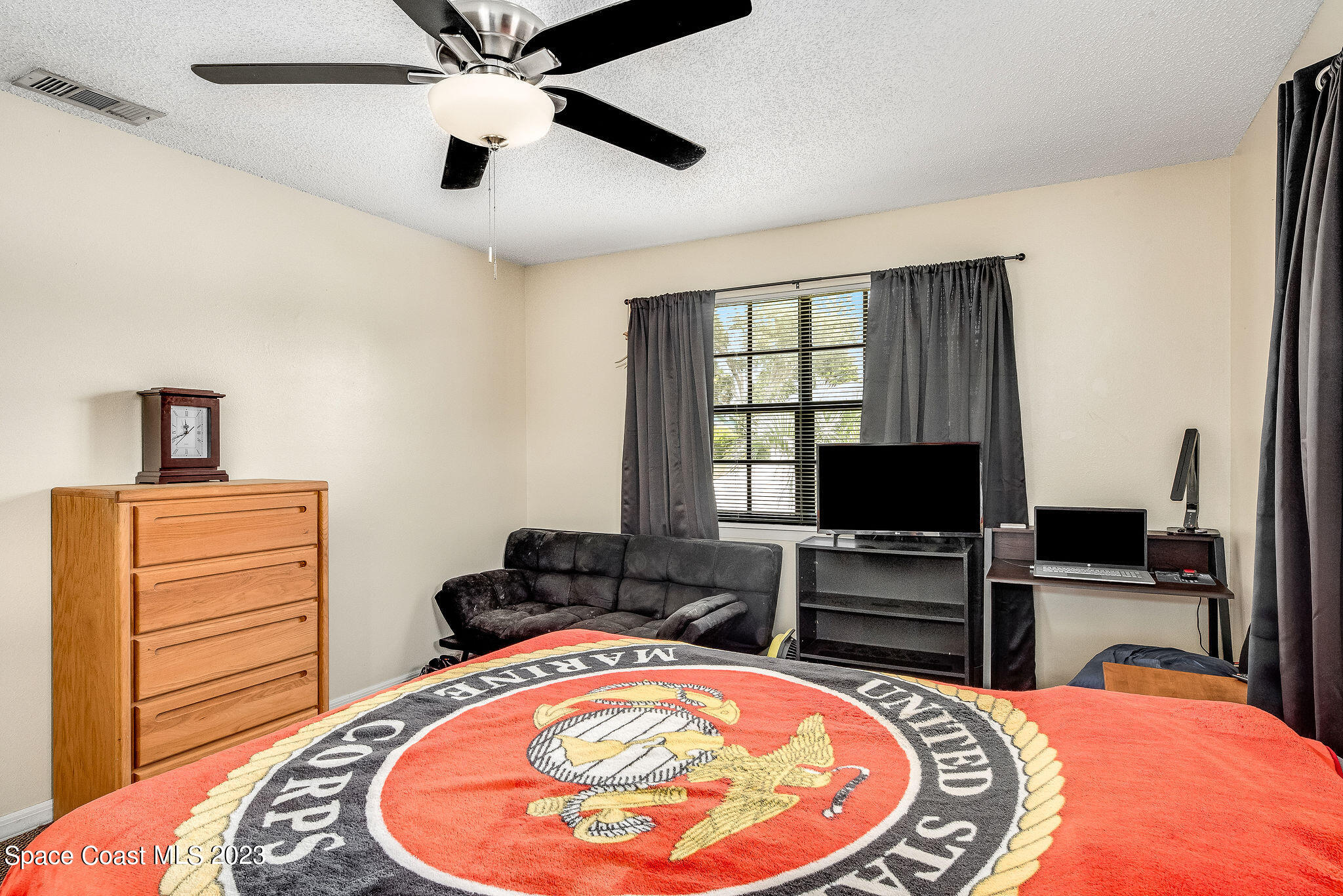 4505 Comfort Street Cocoa, FL 32927 - Photo 14 of 30 a bed room with a bed and a television