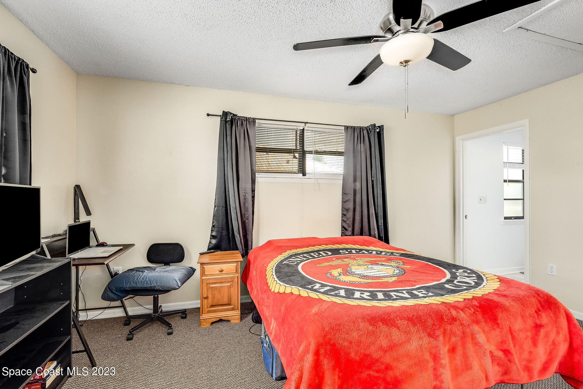 4505 Comfort Street Cocoa, FL 32927 - Photo 15 of 30 a view of a room with gym equipment and a chandelier