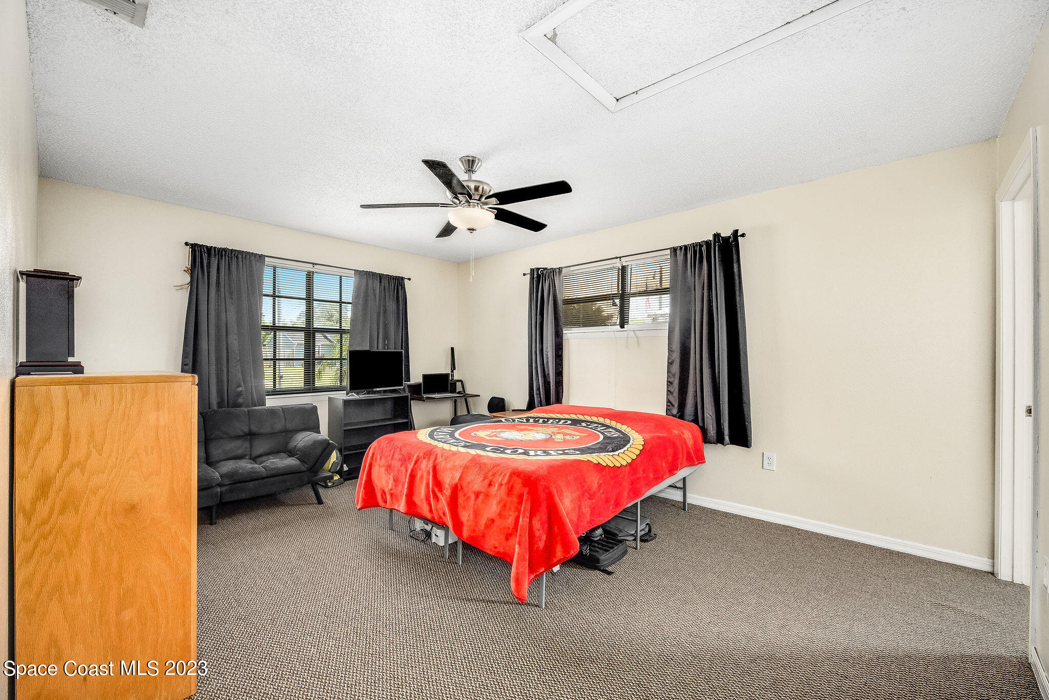 4505 Comfort Street Cocoa, FL 32927 - Photo 16 of 30 a bed sitting in a spacious bedroom next to a window