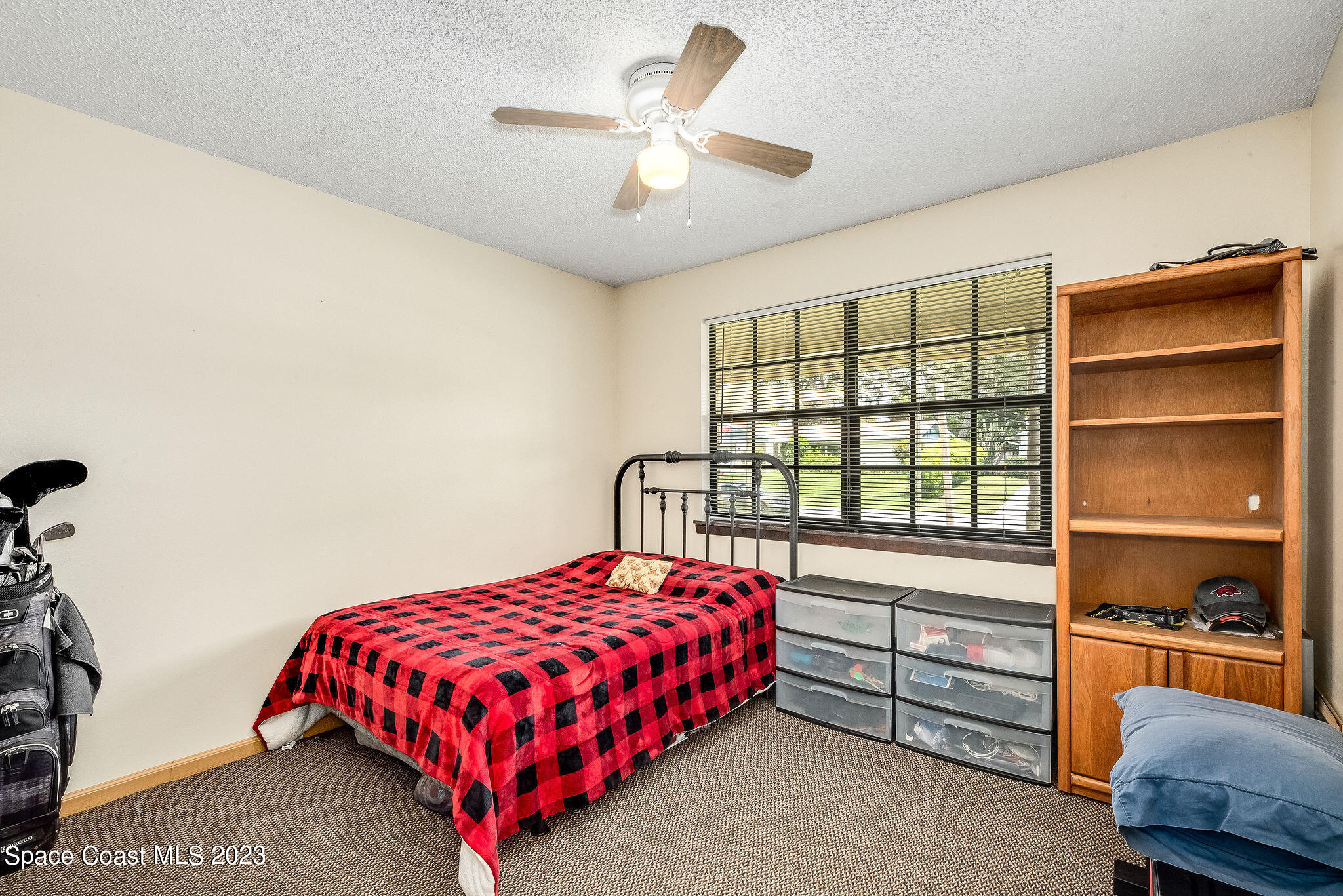4505 Comfort Street Cocoa, FL 32927 - Photo 18 of 30 a bedroom with a bed and a window