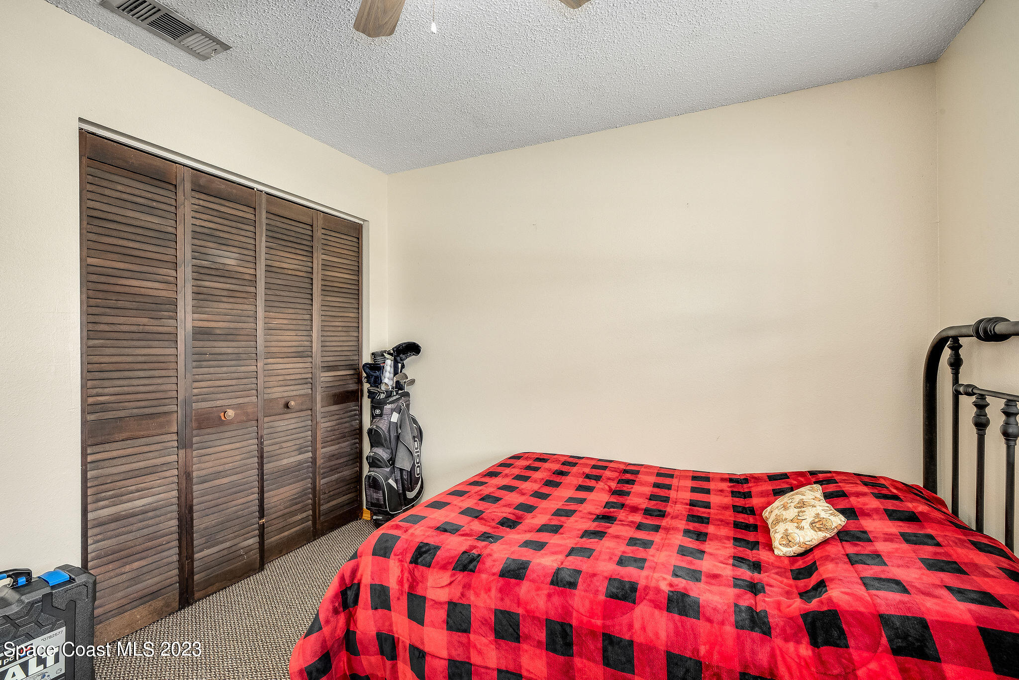 4505 Comfort Street Cocoa, FL 32927 - Photo 19 of 30 a bedroom with a bed and a view of bathroom