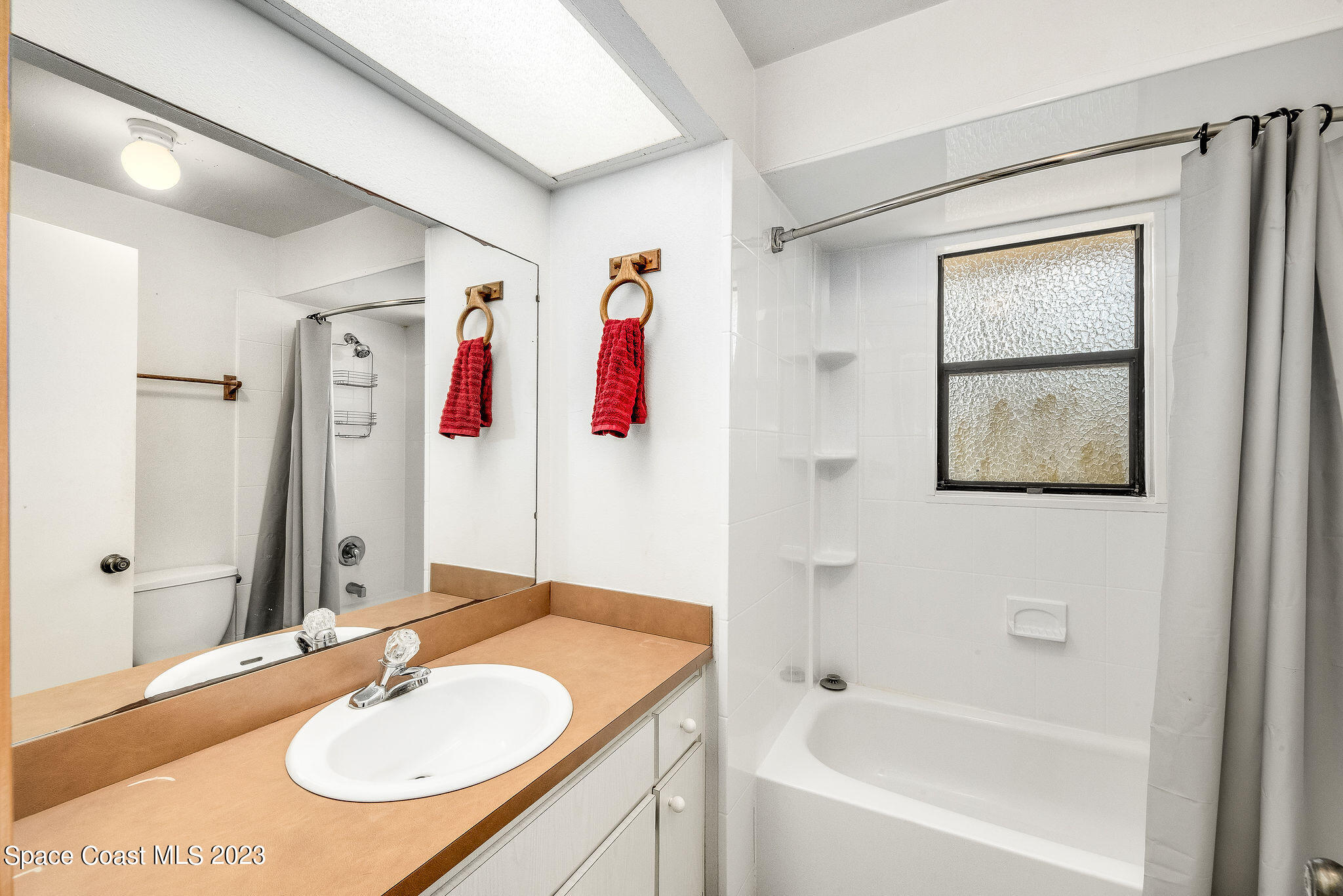 4505 Comfort Street Cocoa, FL 32927 - Photo 20 of 30 a bathroom with a bath tub and a sink