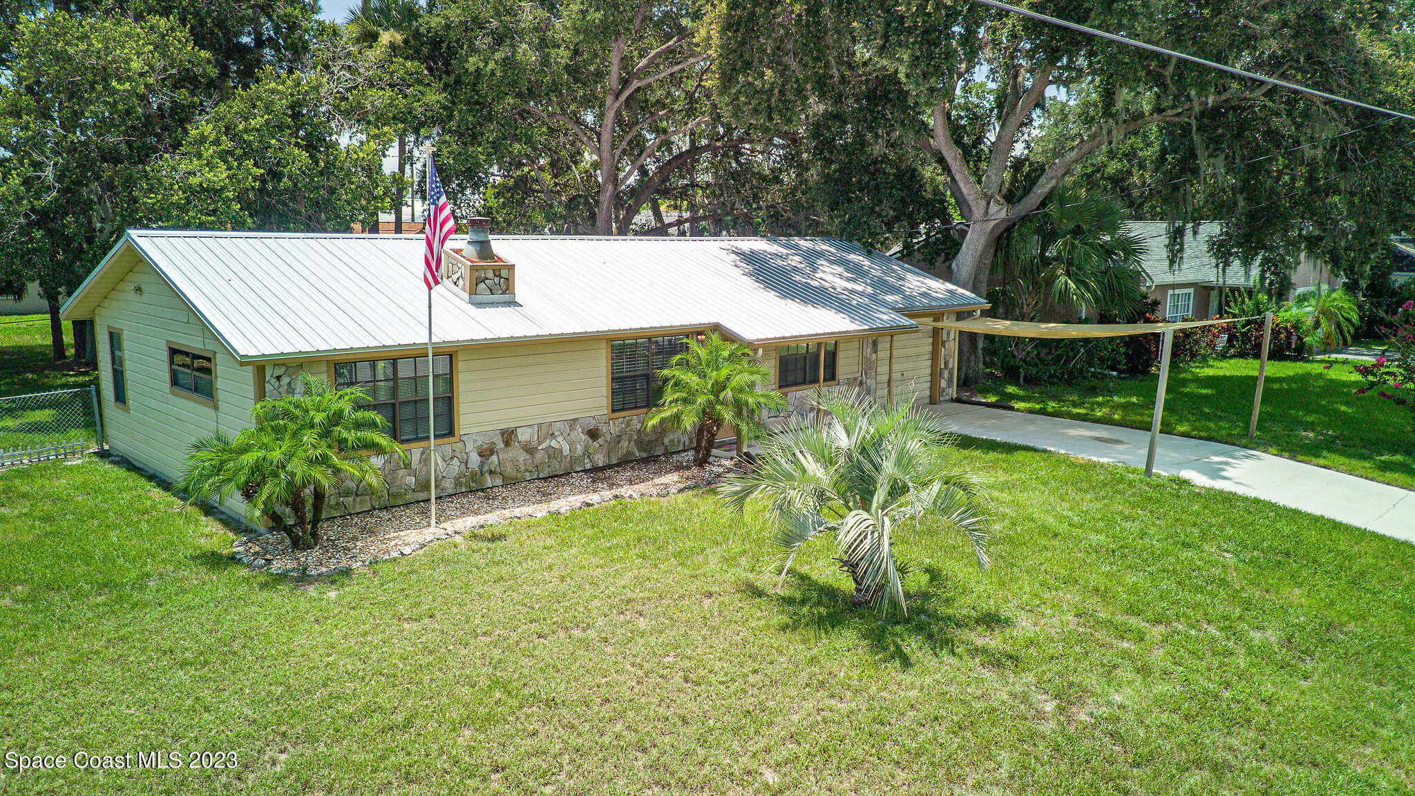 4505 Comfort Street Cocoa, FL 32927 - Photo 22 of 30 a view of a house with backyard and sitting area