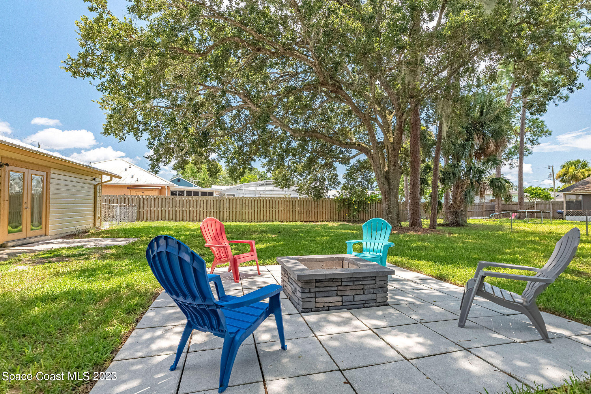 4505 Comfort Street Cocoa, FL 32927 - Photo 9 of 30 a backyard of a house with table and chairs