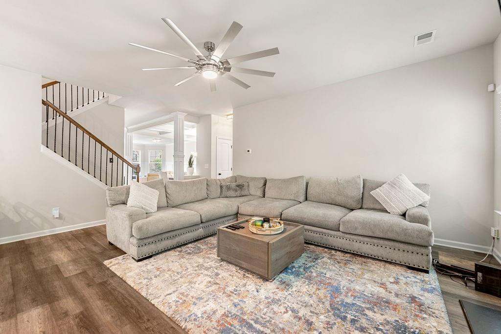 2357 Red Hibiscus Court Atlanta, GA 30331 - Photo 1 of 1 a living room with furniture a large window and a chandelier