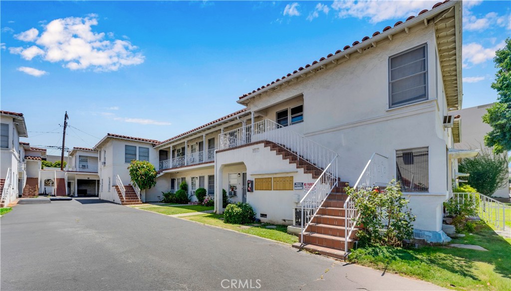 34 North 1st Street, Unit 3 Alhambra, CA 91801 - Photo 1 of 6 a front view of a house with a yard