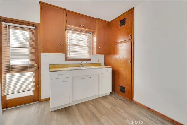 a room with a stove and a window