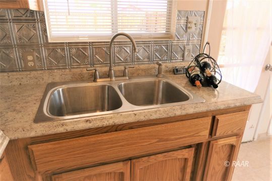 744 West Reeves Avenue Ridgecrest, CA 93555 - Photo 11 of 26 a close view of sink and tap