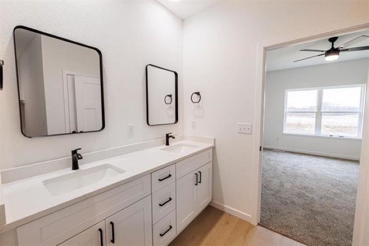 14212 Prairie Commons Lane South Beloit, IL 61080 - Photo 15 of 23 a bathroom with 2 sink and a mirror