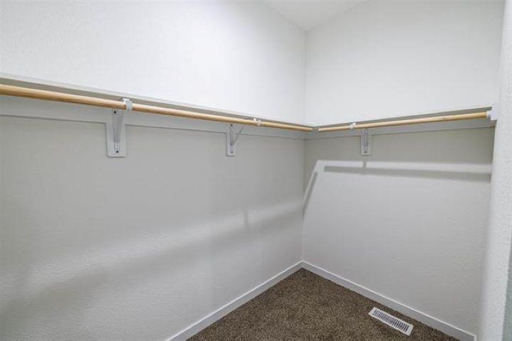 14212 Prairie Commons Lane South Beloit, IL 61080 - Photo 18 of 23 a view of a room with racks on the wall